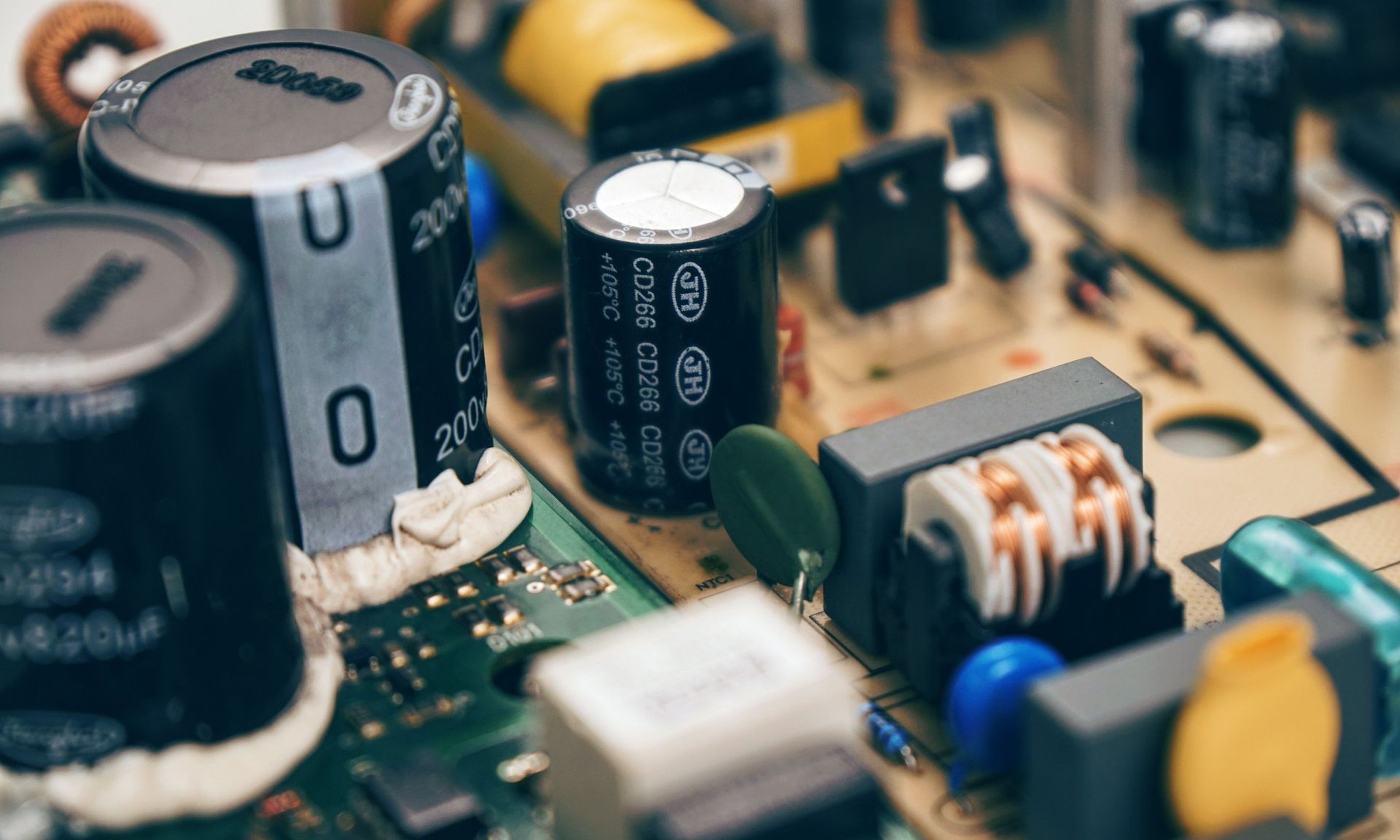 Close-up of electronic circuit board with capacitors, coils, and other components