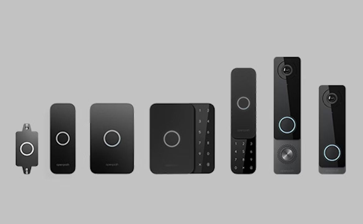 Collection of black smart home devices with circular button and light ring.
