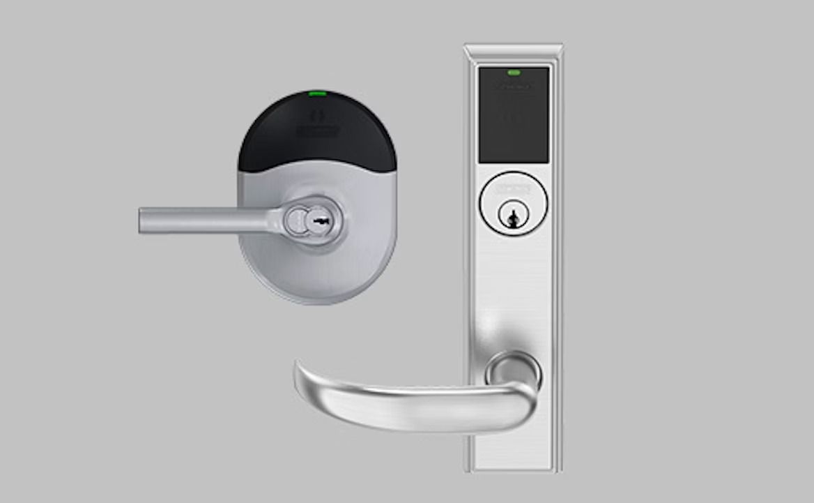 Silver electronic door lockset with lever handles and card reader.