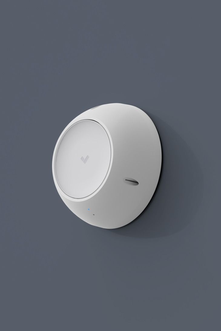 White, egg-shaped dome mounted on a gray wall.