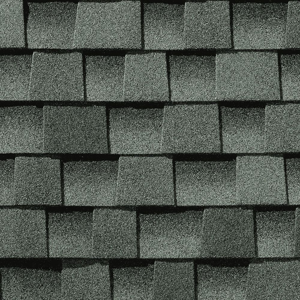 Dark gray asphalt roof shingles.