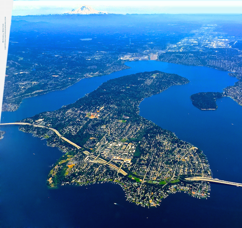 Logo of Kent, Washington: blue roof shape, green wave, red dot, and 