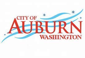City of Auburn, Washington logo in red and blue with swooping blue lines and stars