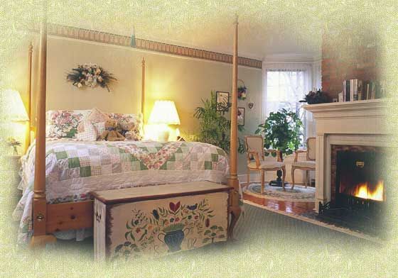 A bedroom with a four poster bed and a fireplace