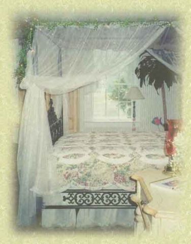 A bedroom with a canopy bed and a lamp.
