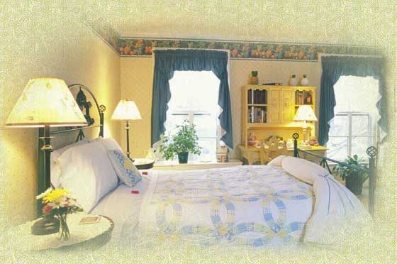 A bedroom with a large bed and two lamps