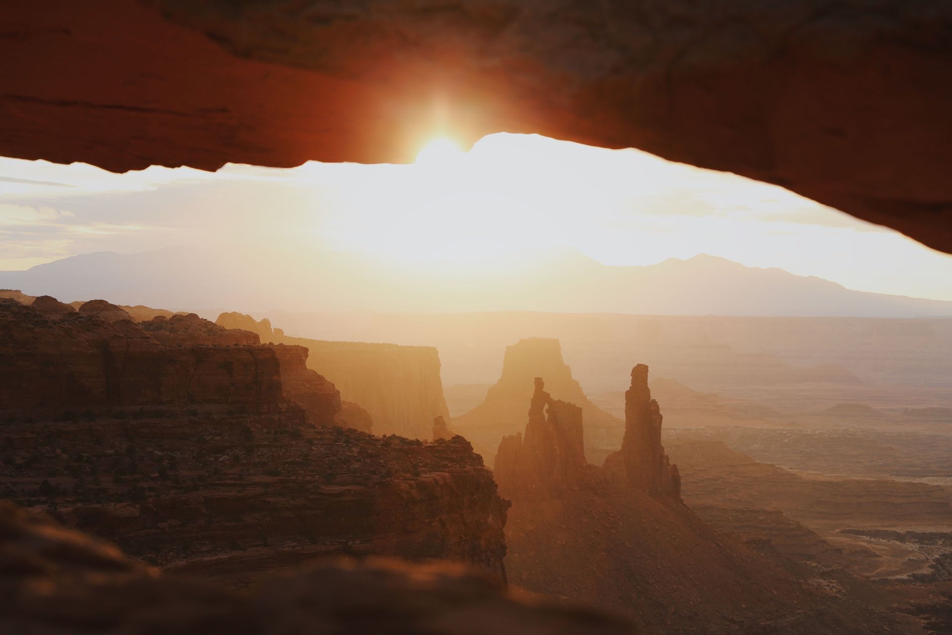 Sunrise seen through Mesa Arch in Canyonlands National Park