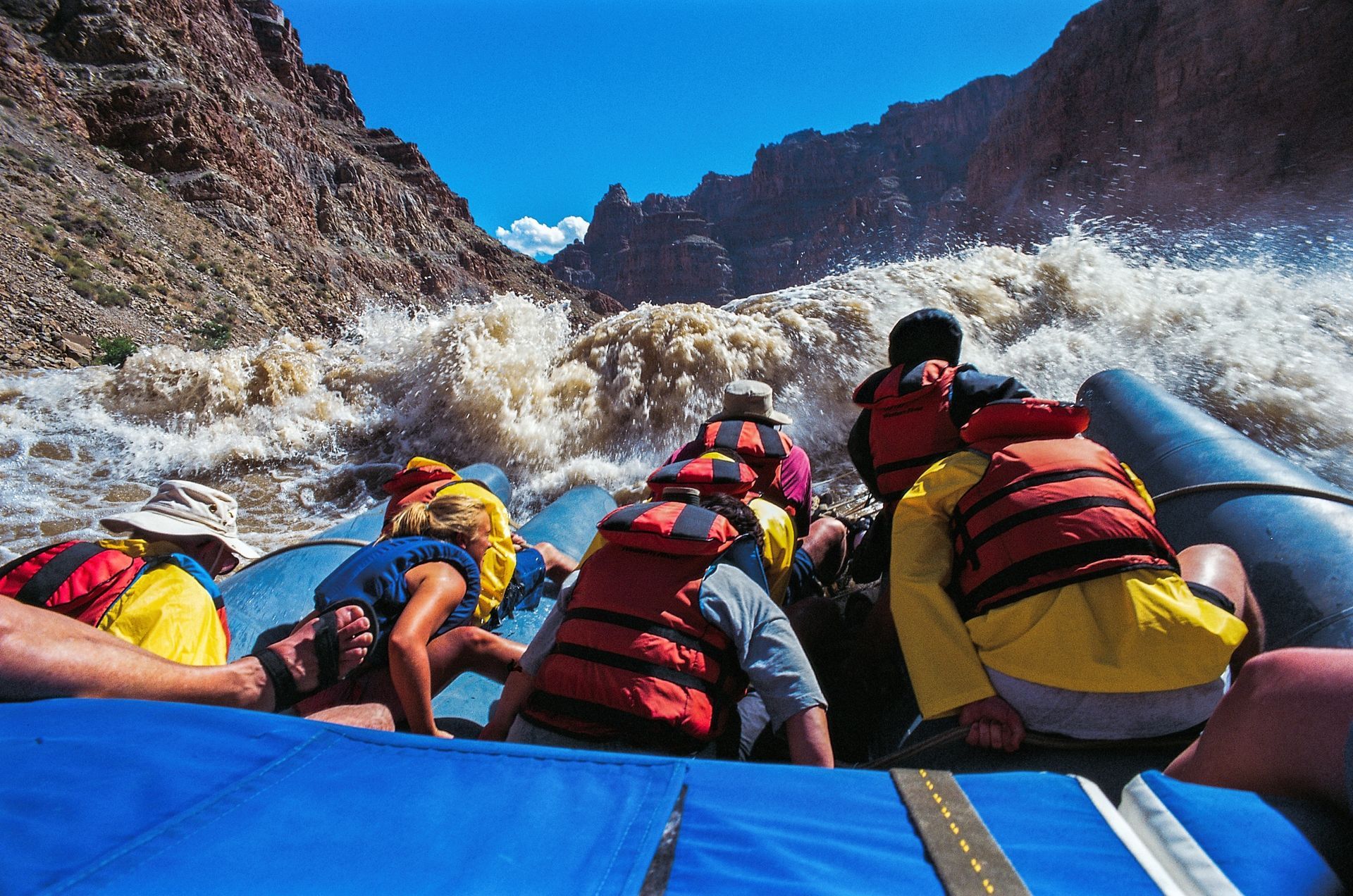 View from a raft as guests approach a large whitewater wave