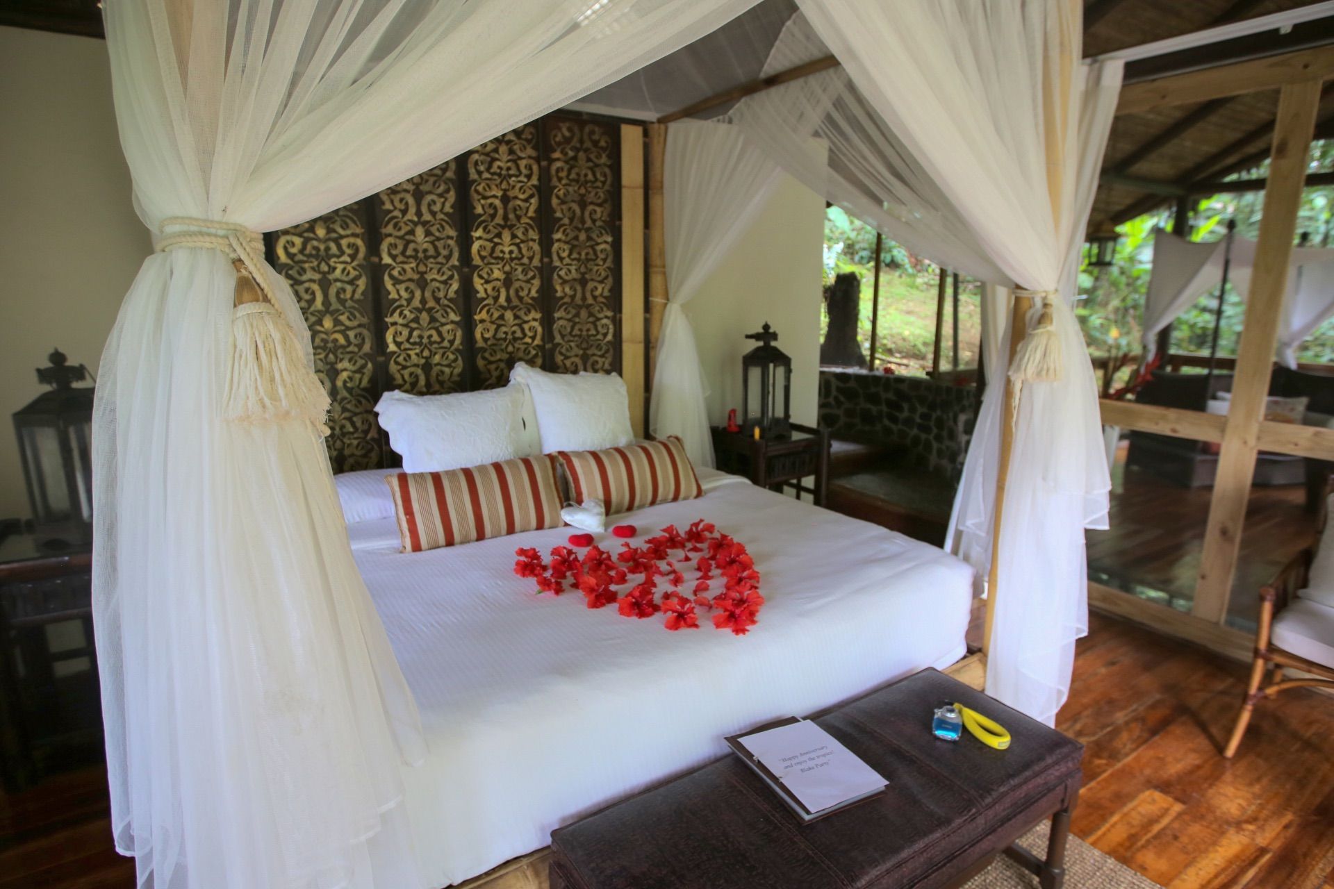 Bed beneath a canopy in a Costa Rica lodge room