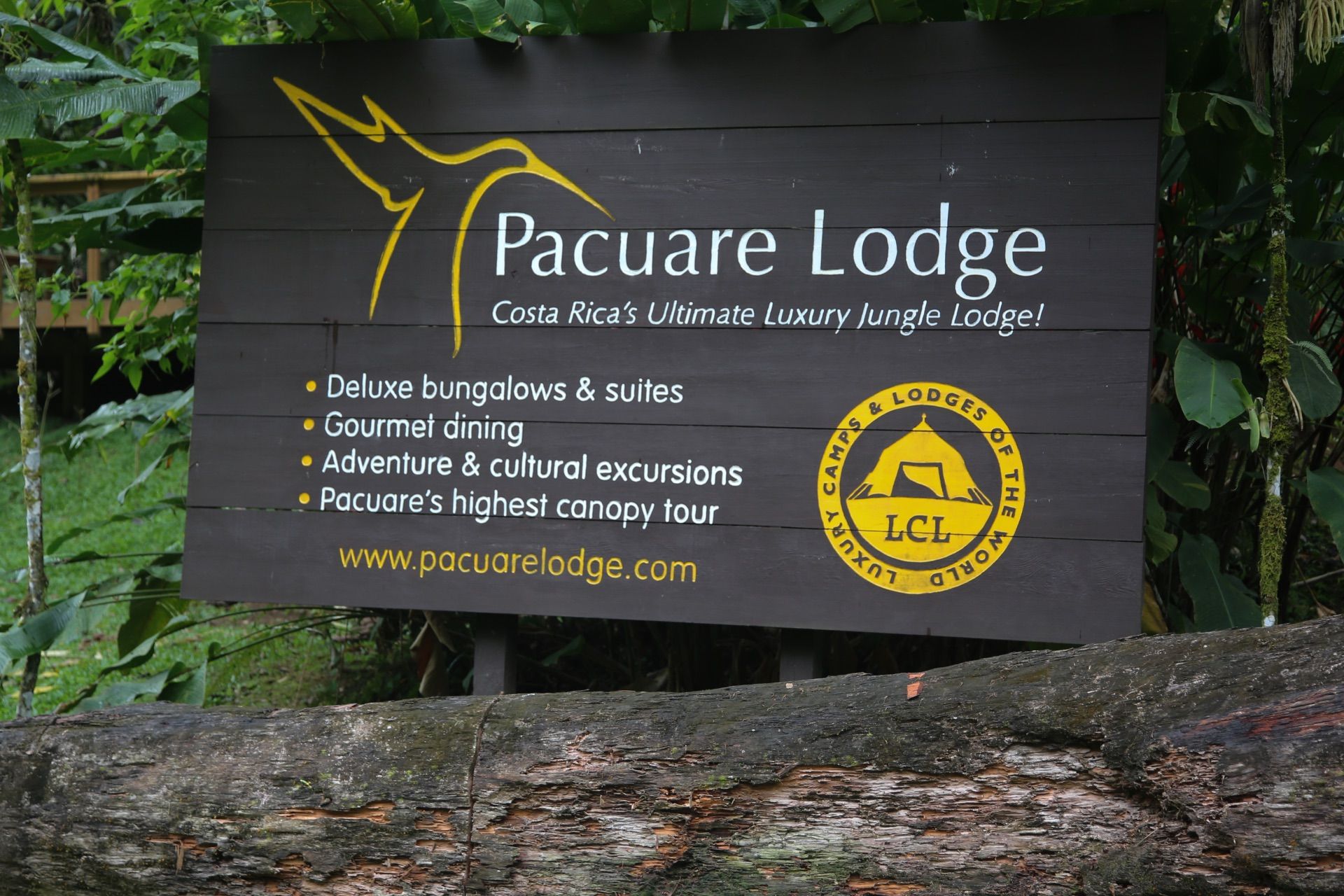 Pacuare Lodge sign surrounded by tropical plants
