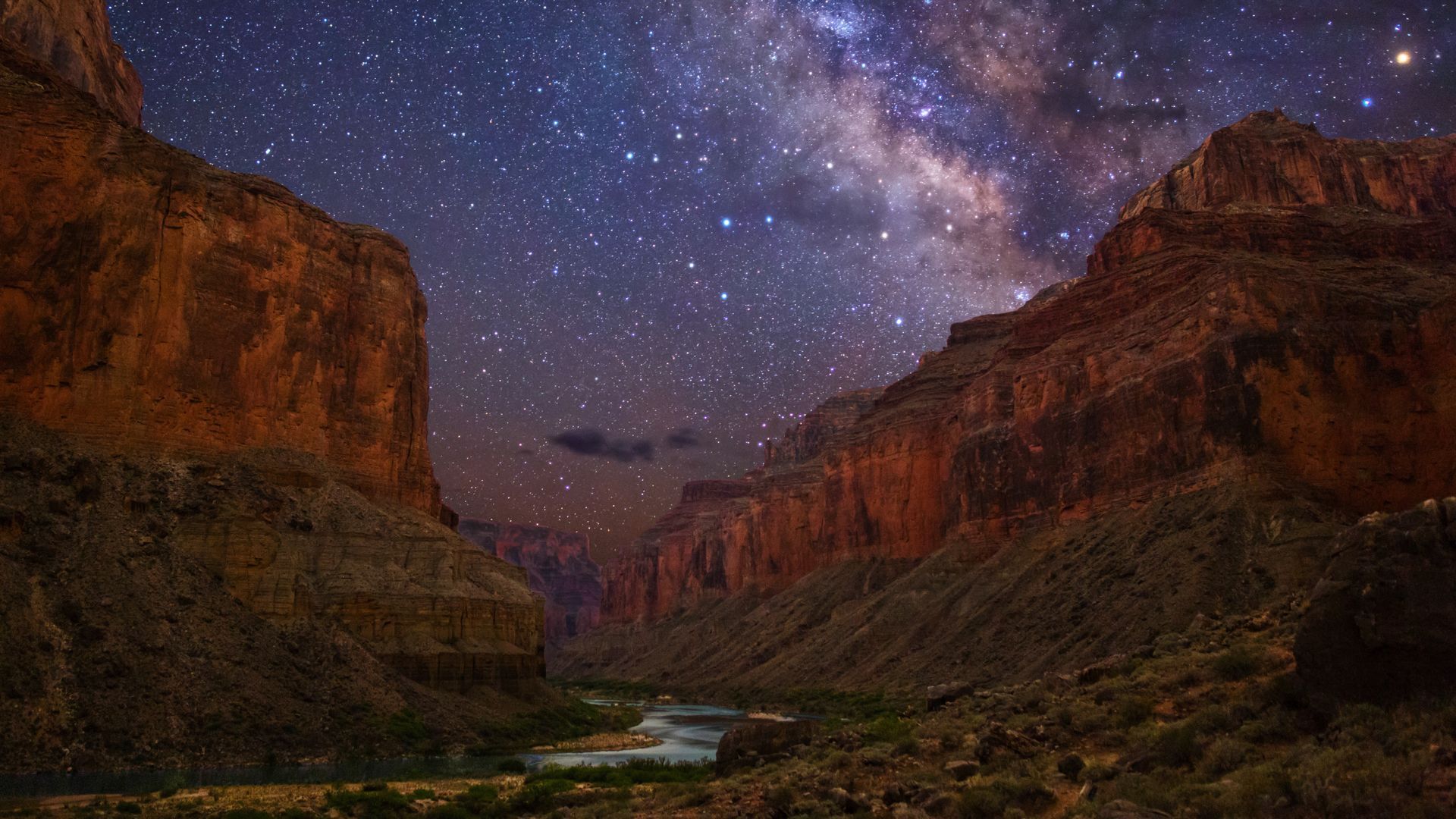 Stars and the Milky Way above Grand Canyon’s silhouetted walls