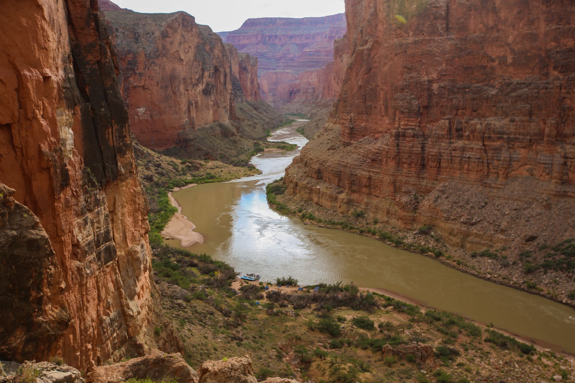 The Colorado River winding beneath Grand Canyon’s walls