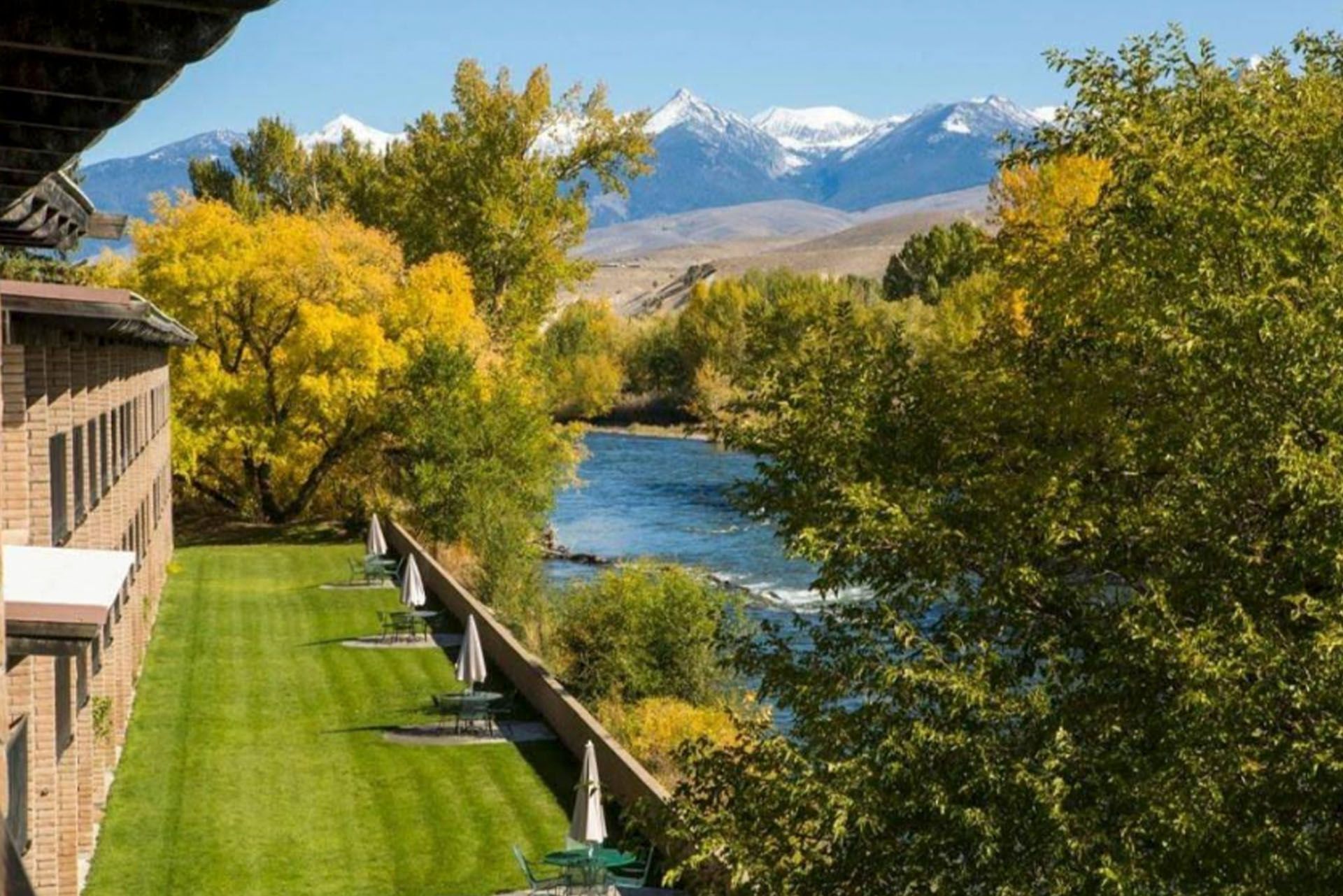 Lawn and river views beside an Idaho inn