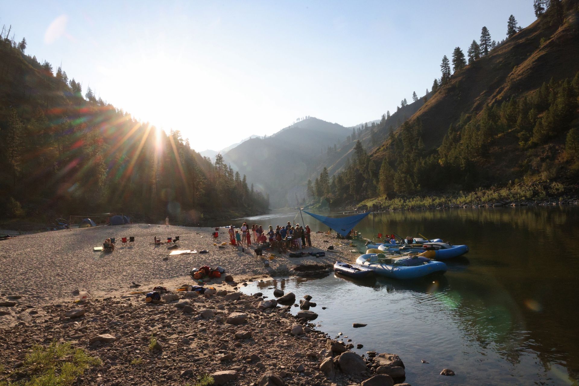 A rafting camp on a sandy Salmon River beach in evening light