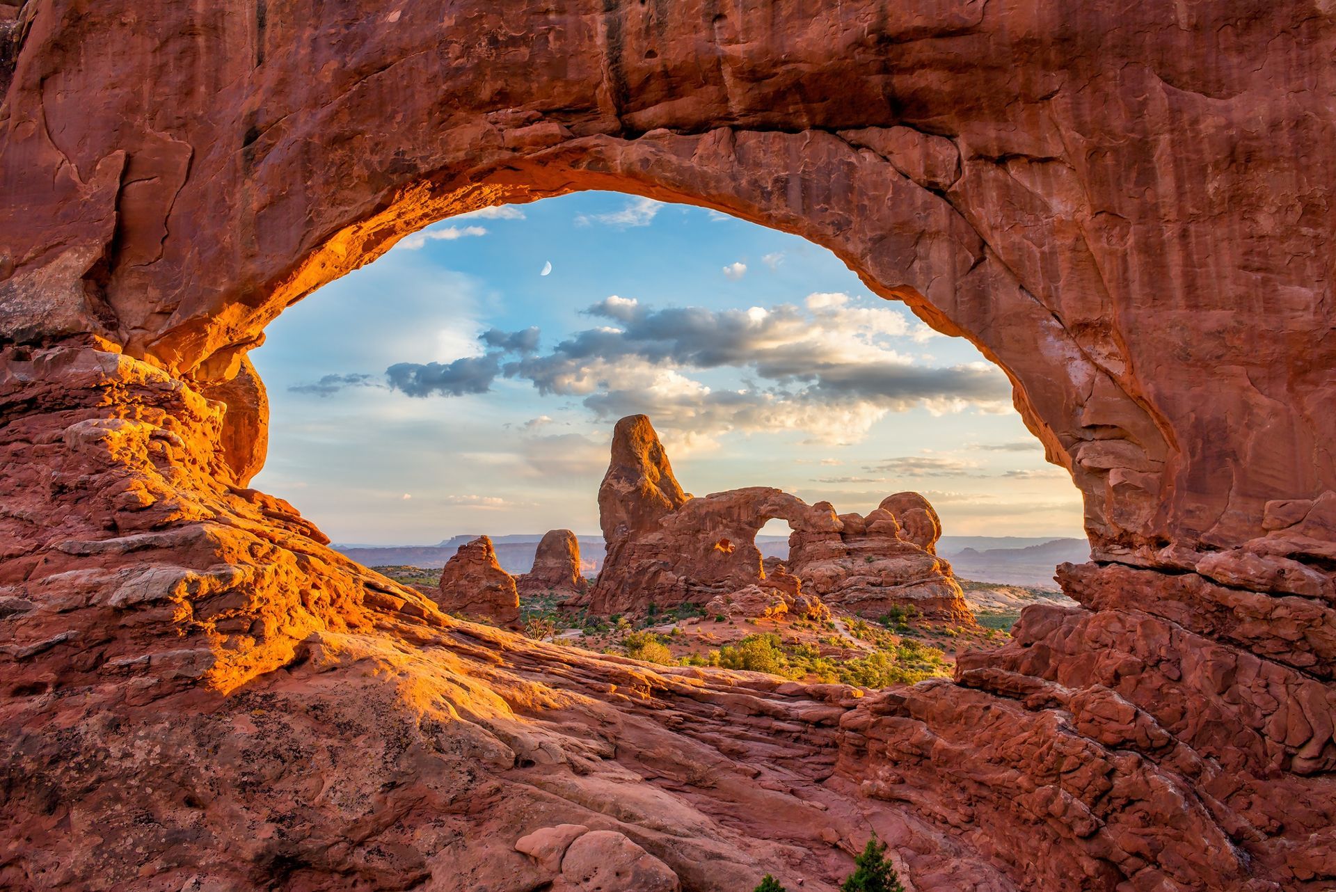 View through North Window Arch in Arches National Park with Turret Arch showing in the distance.