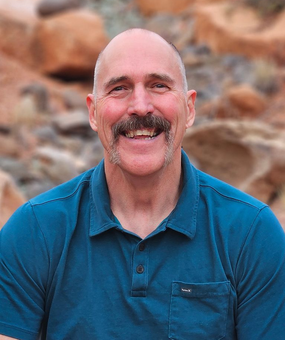 Trent Keller smiling in a portrait photograph