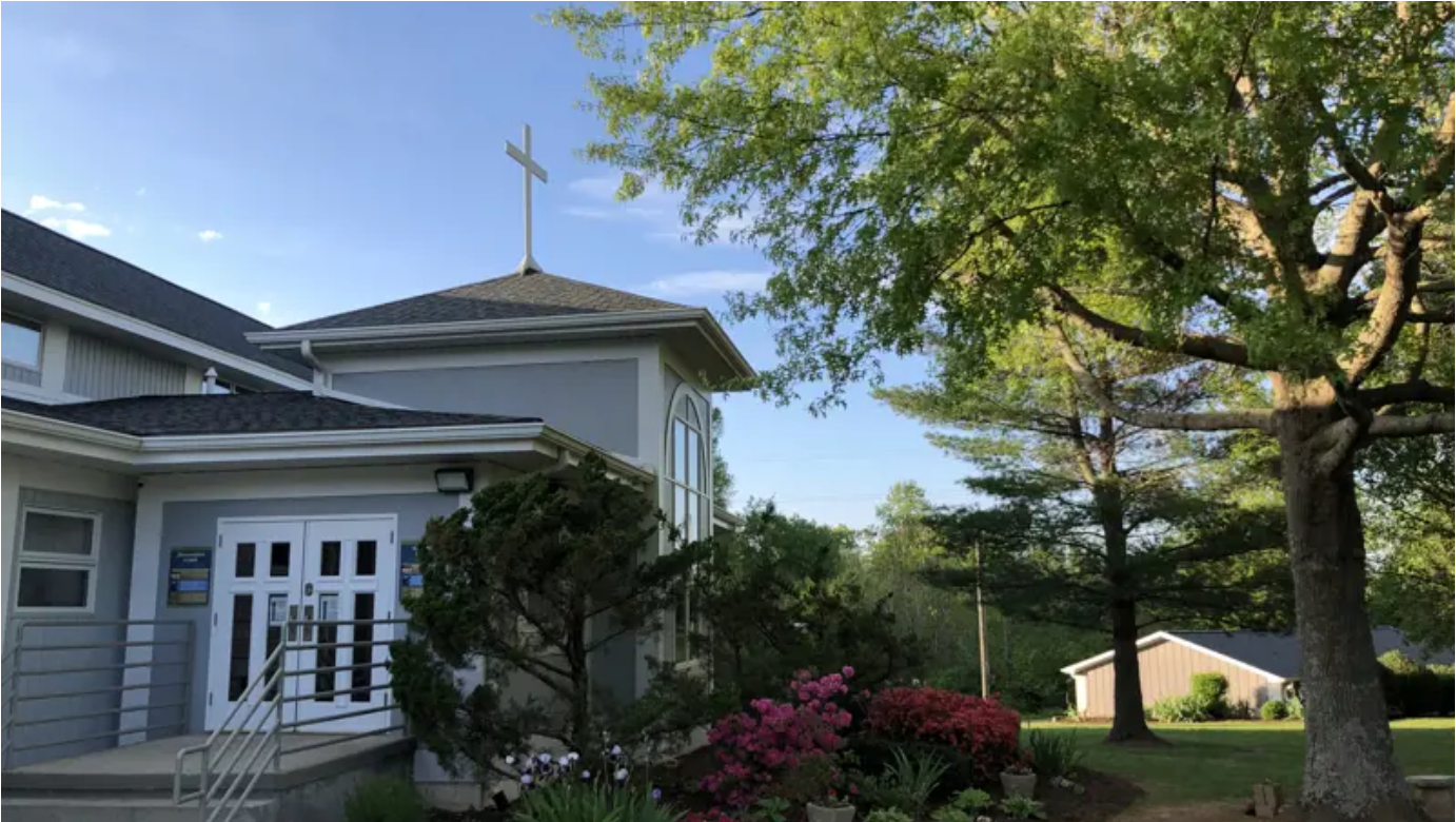 A church with a cross on top of it