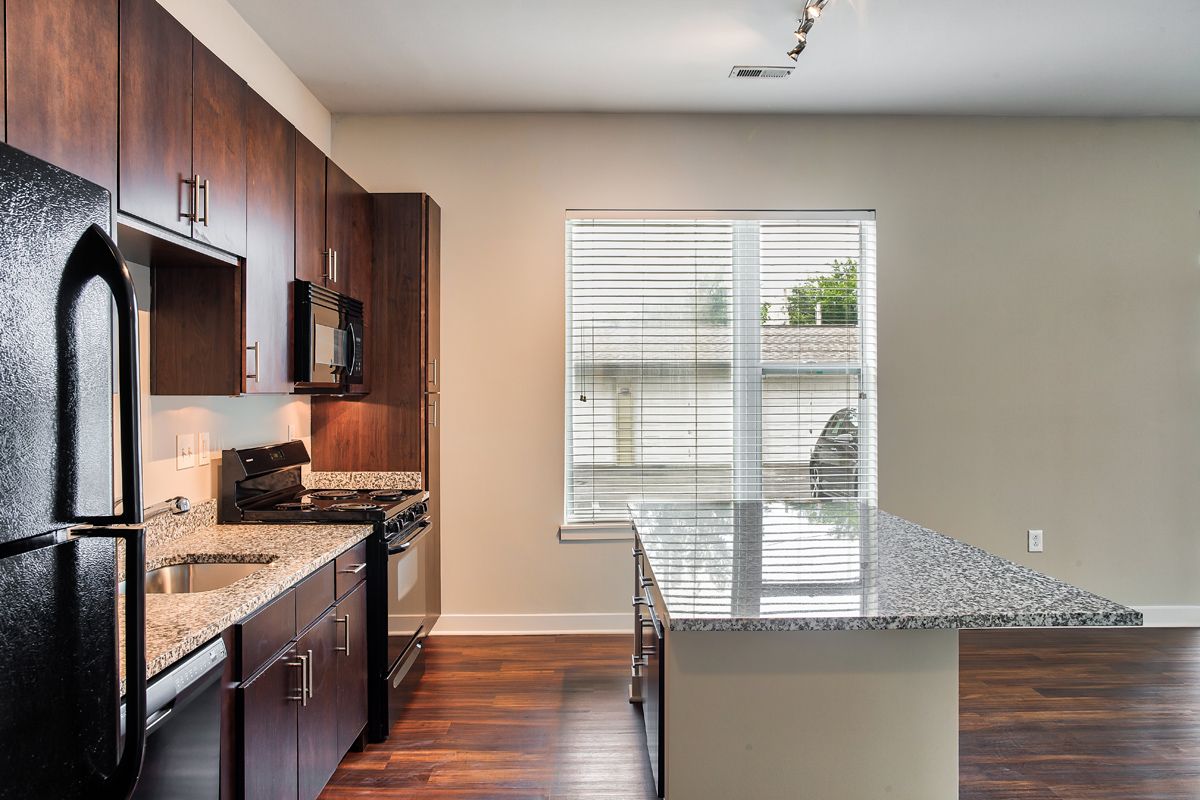 Kitchen With Cabinets & Granite Countertops