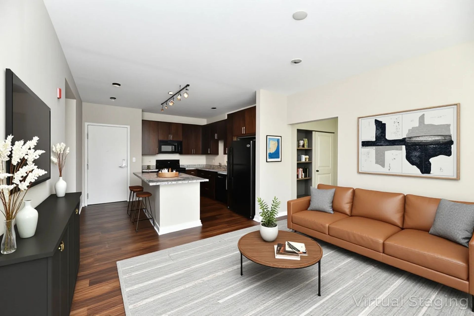 Apartment Featuring Leather Sofa & Open Kitchen Area