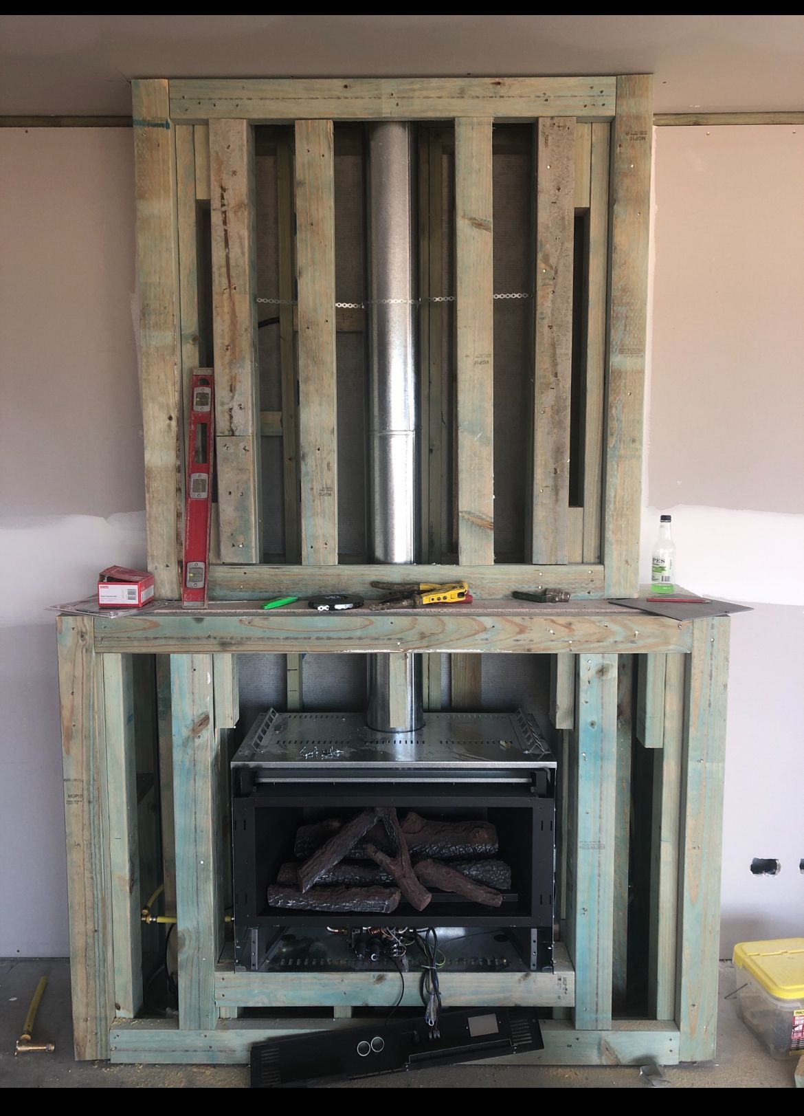 Fireplace Under Construction, Built From Wooden Pallets — Croker Plumbing and Gas in Goulburn, NSW