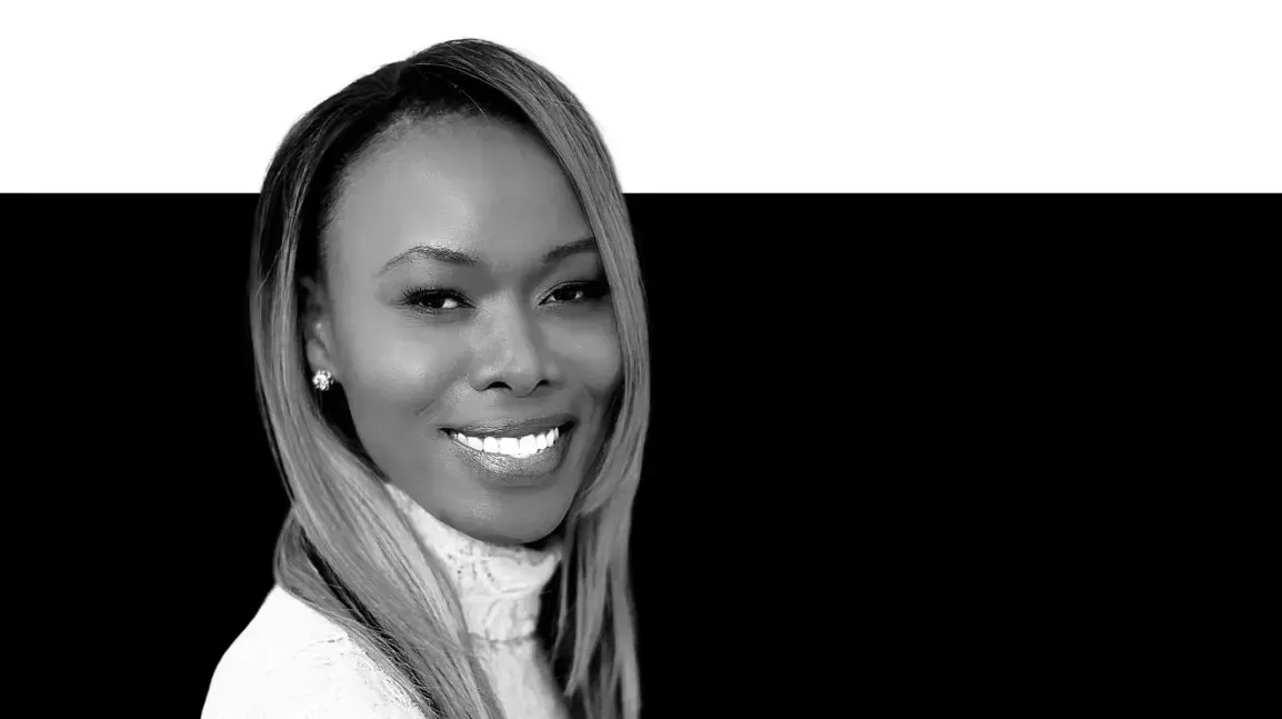 Black-and-white portrait of Rosebell Murigu with long straight hair against a dark background