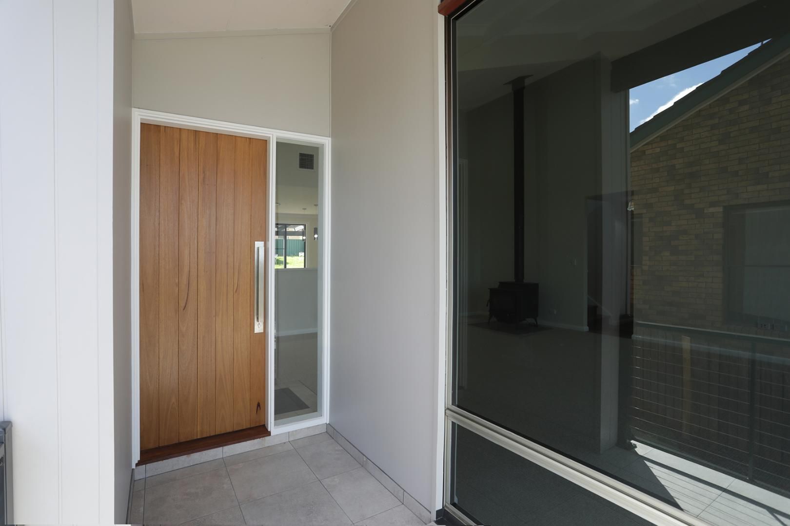 A House With a Wooden Door and a Glass Door — Kareela Constructions In Tamworth, NSW