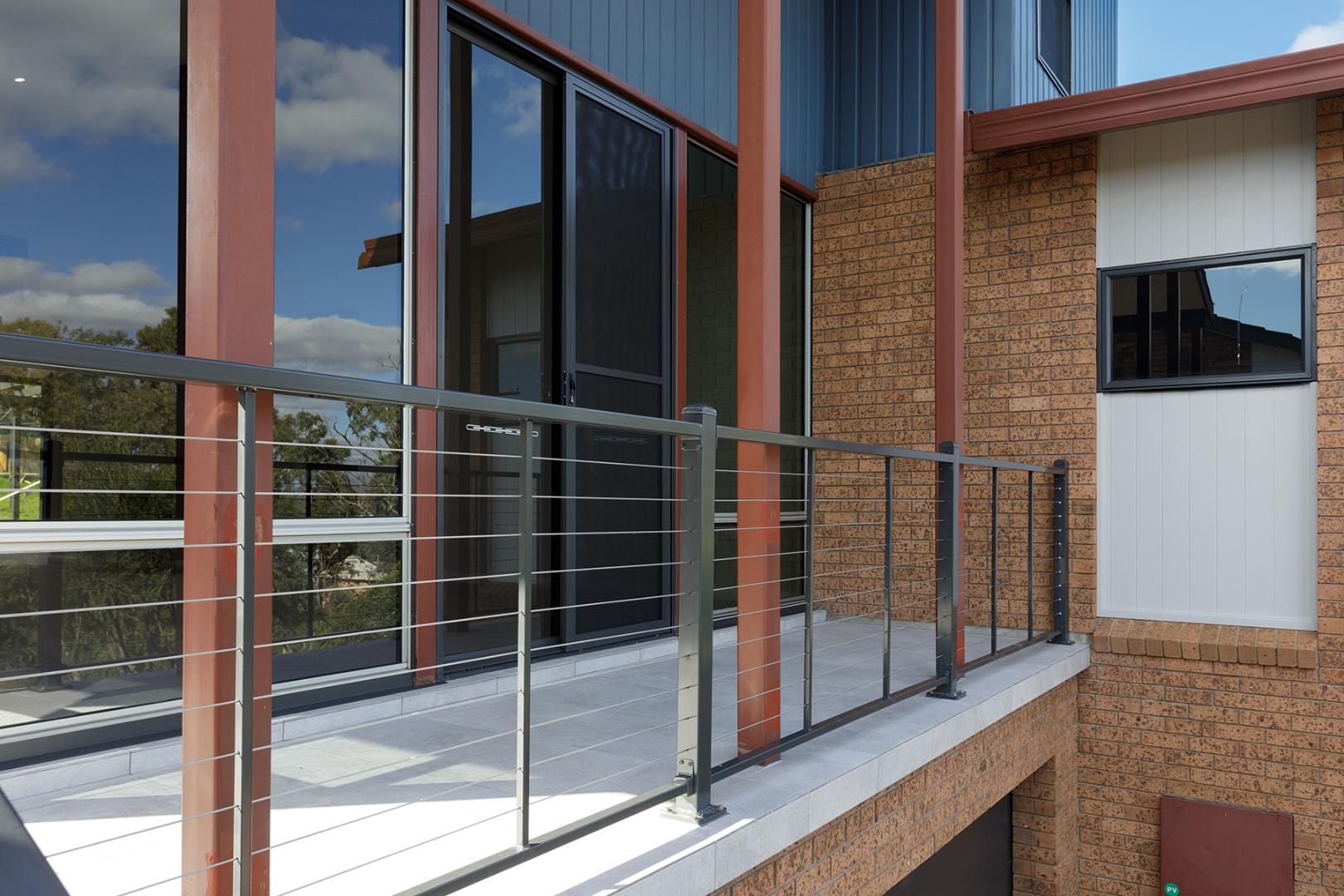 A Balcony on the Side of a House With a Stainless Steel Railing — Kareela Constructions In Tamworth, NSW