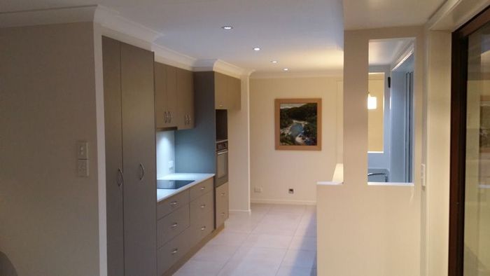 A Hallway Leading to a Kitchen With a Picture on the Wall — Kareela Constructions In Tamworth, NSW