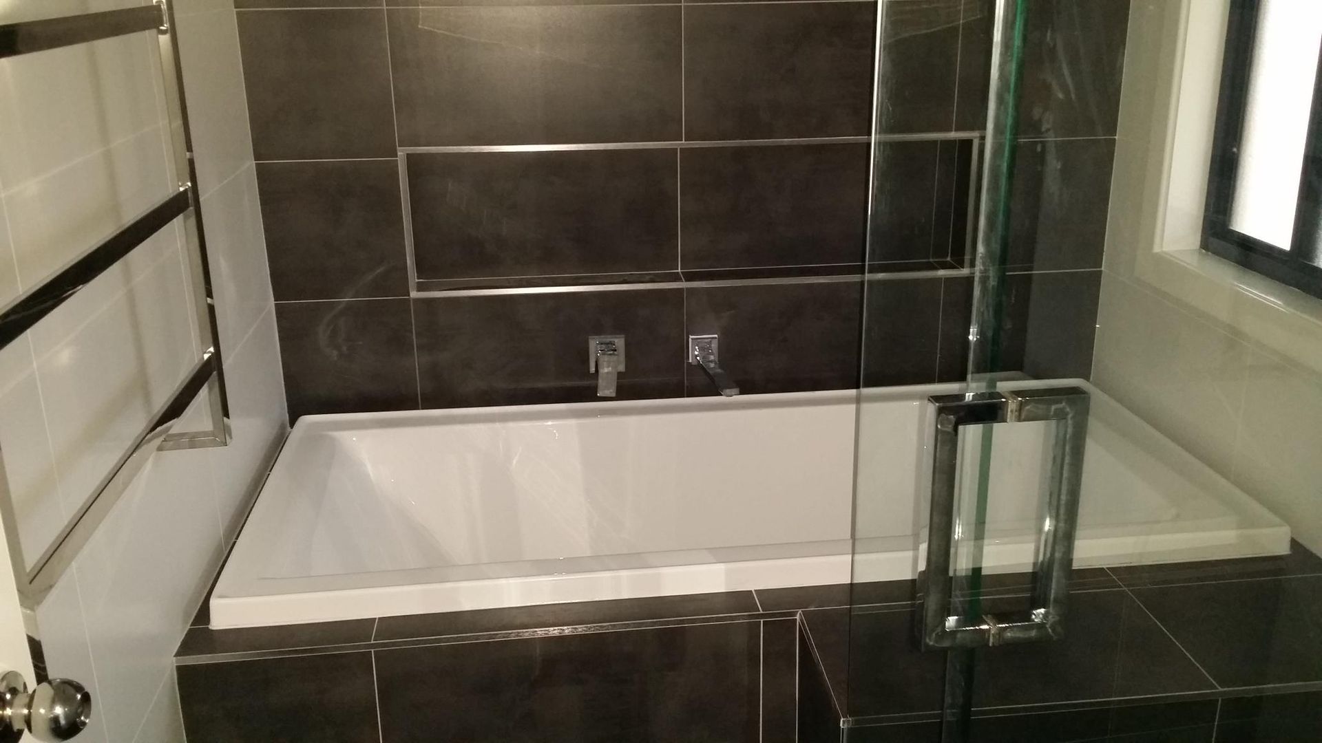 A Bathroom With a Bathtub and a Shower Stall — Kareela Constructions In Tamworth, NSW