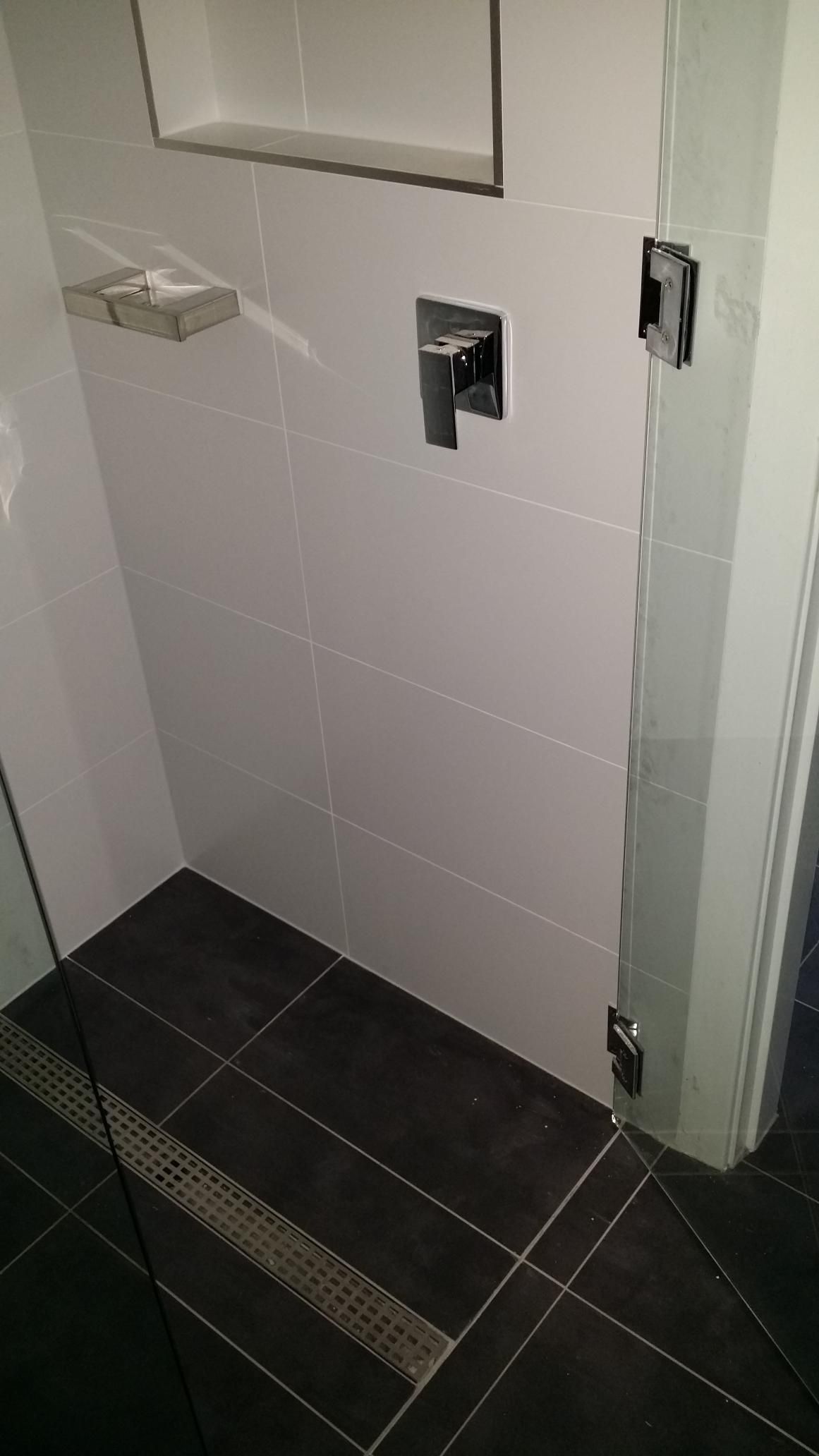 A Bathroom With a Walk in Shower and a Glass Door — Kareela Constructions In Tamworth, NSW