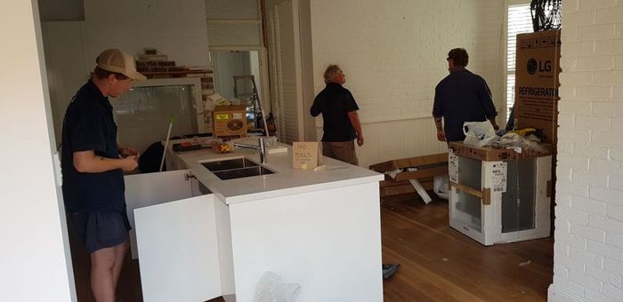 A Group of Men Are Working in a Kitchen — Kareela Constructions In Tamworth, NSW