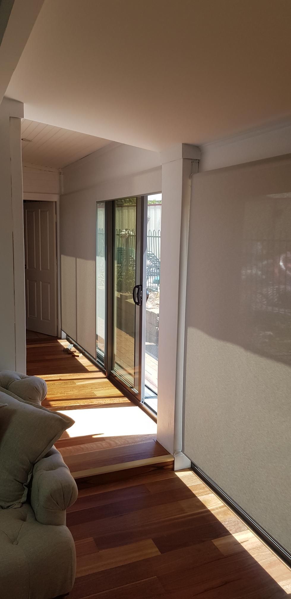 A Living Room With a Couch and a Sliding Glass Door — Kareela Constructions In Tamworth, NSW