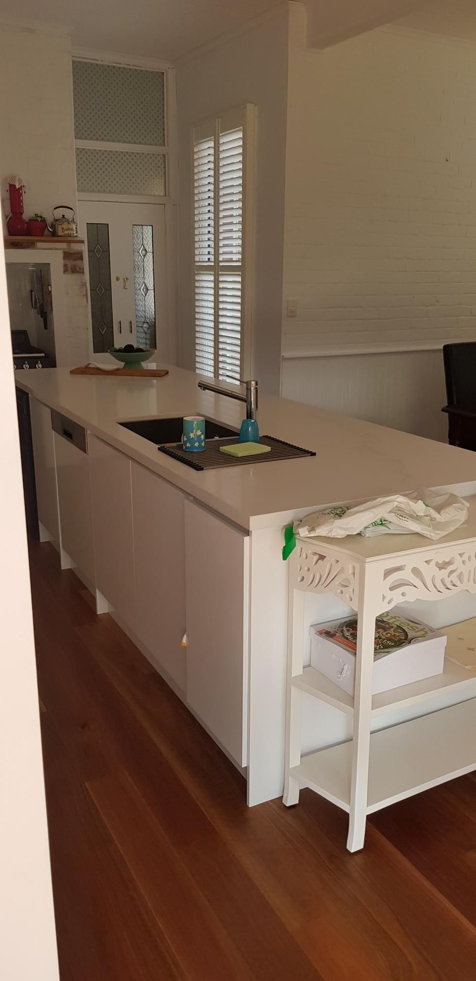 A Kitchen With a Large Island and a Sink — Kareela Constructions In Tamworth, NSW