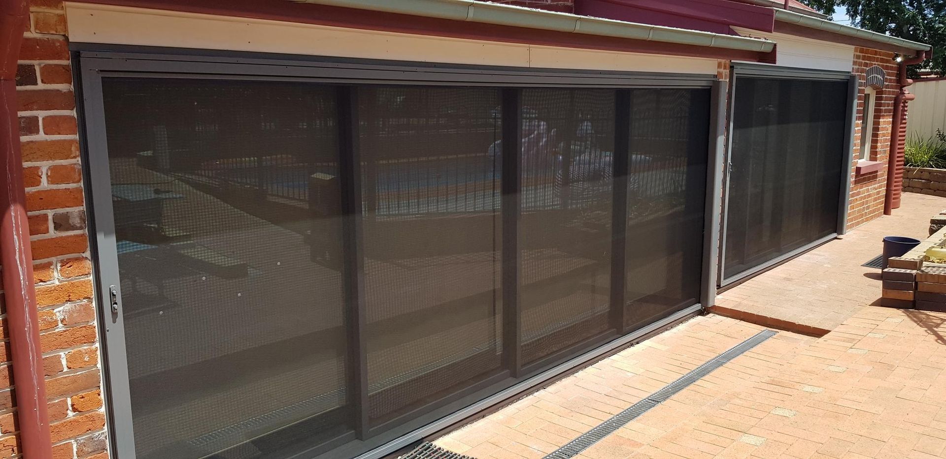 A House With Sliding Glass Doors and a Brick Wall — Kareela Constructions In Tamworth, NSW