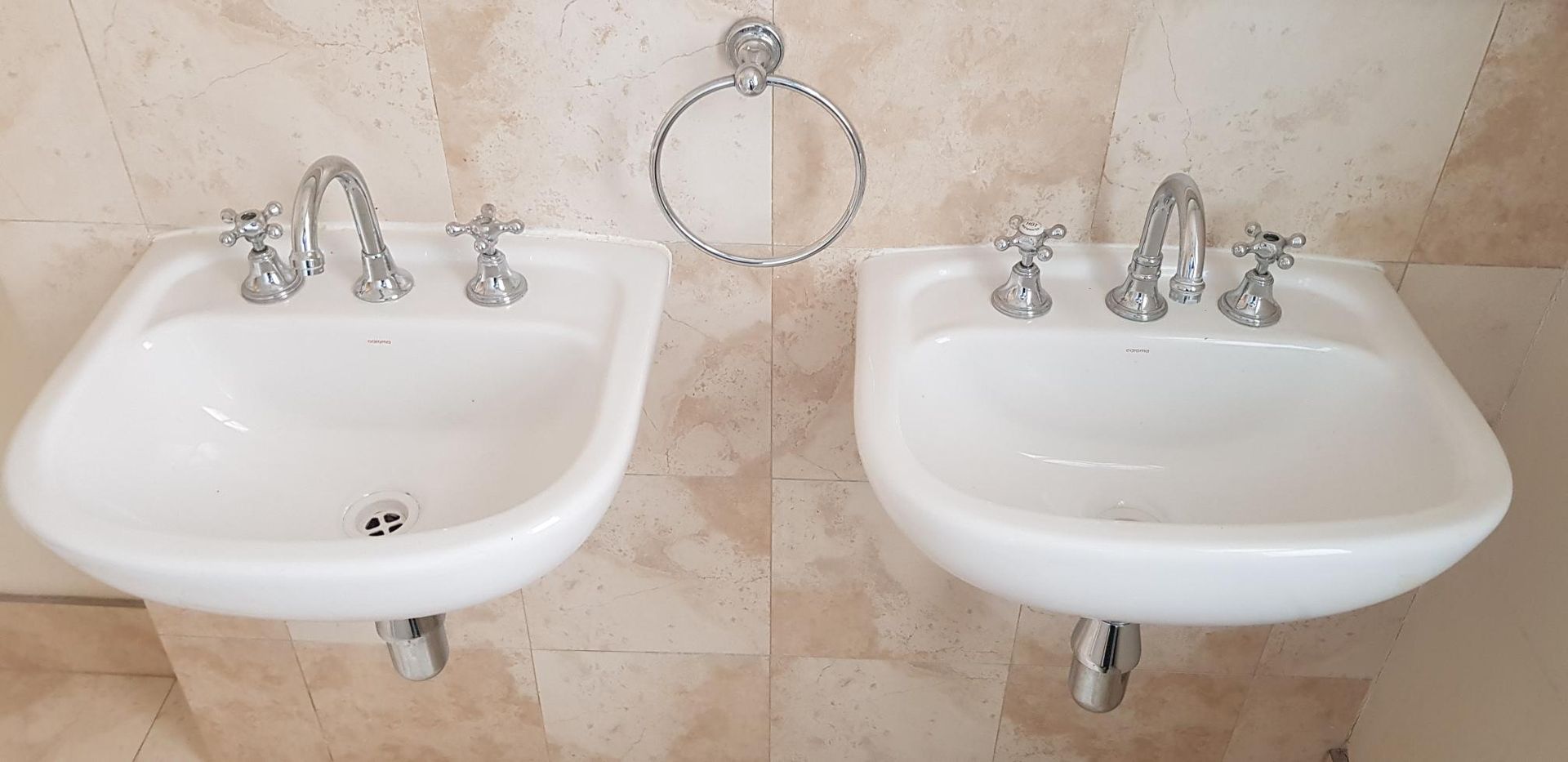 Two White Sinks Are Sitting Next to Each Other in a Bathroom — Kareela Constructions In Tamworth, NSW