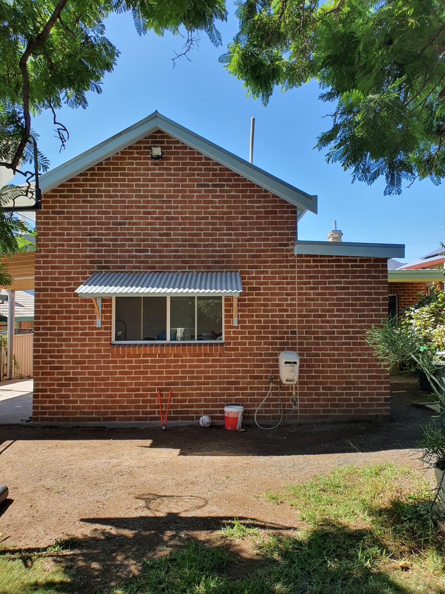 The Back of a Brick House With a Roof and a Window — Kareela Constructions In Tamworth, NSW
