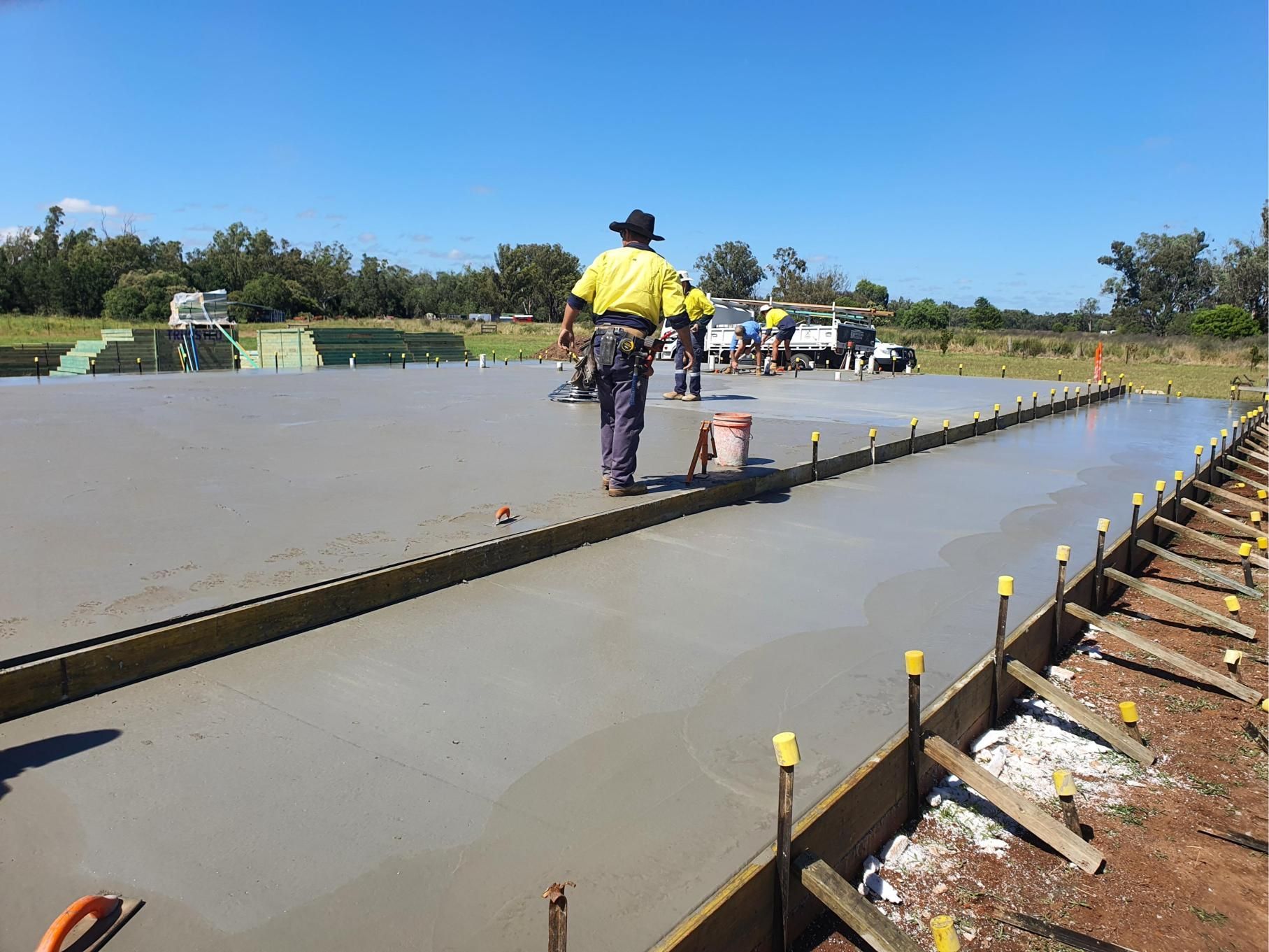 A Man is Walking on a Concrete Surface — Kareela Constructions In Tamworth, NSW
