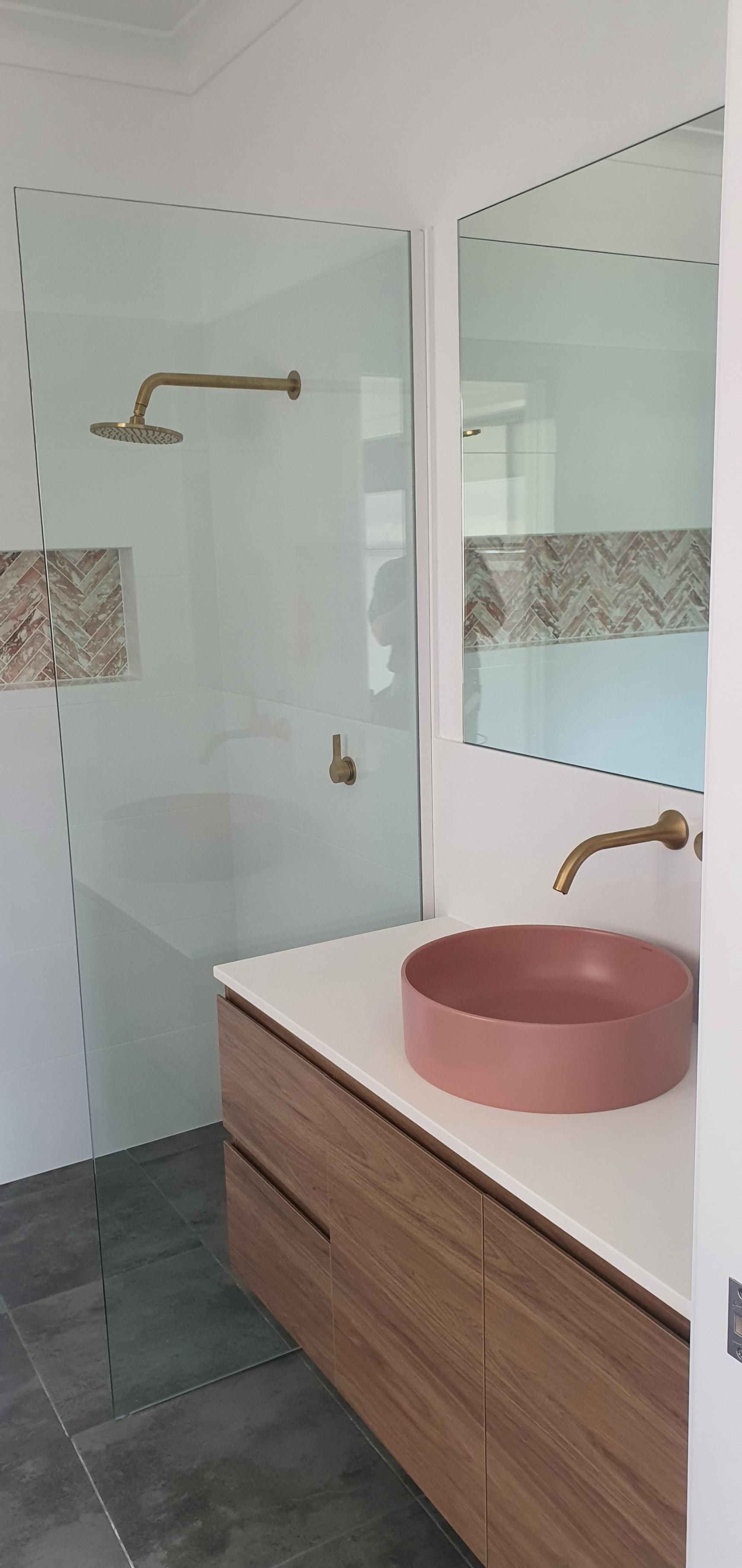 A Bathroom With a Pink Sink and a Walk in Shower — Kareela Constructions In Tamworth, NSW