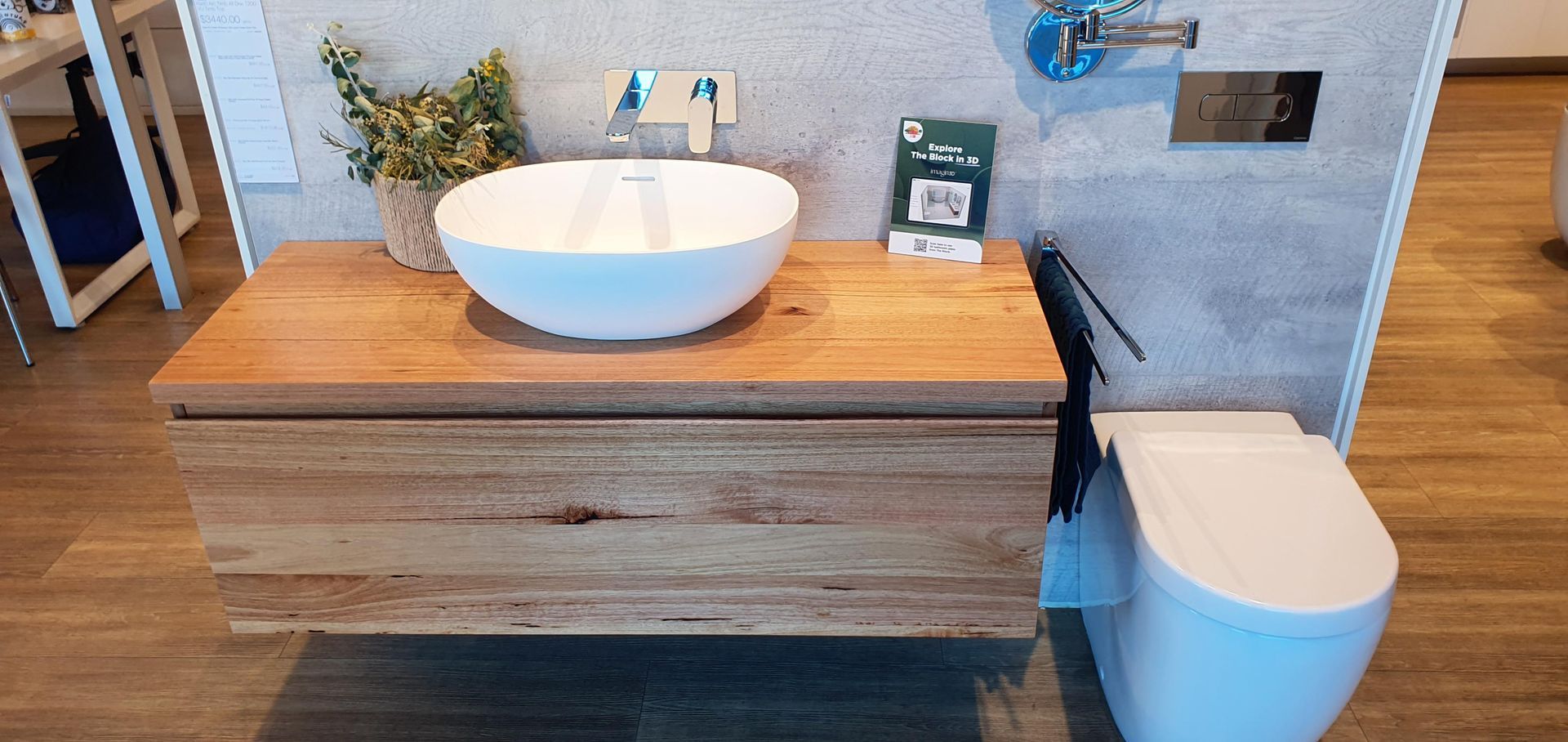 A Bathroom With a Sink Toilet and Wooden Cabinet — Kareela Constructions In Tamworth, NSW