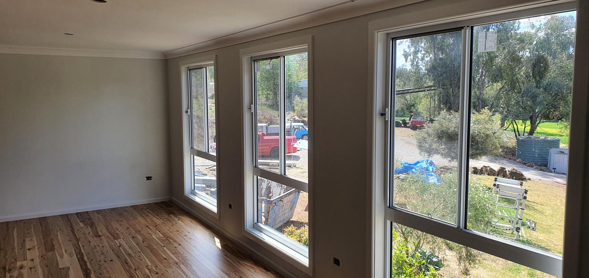 A Room With a Lot of Windows and a Wooden Floor — Kareela Constructions In Tamworth, NSW