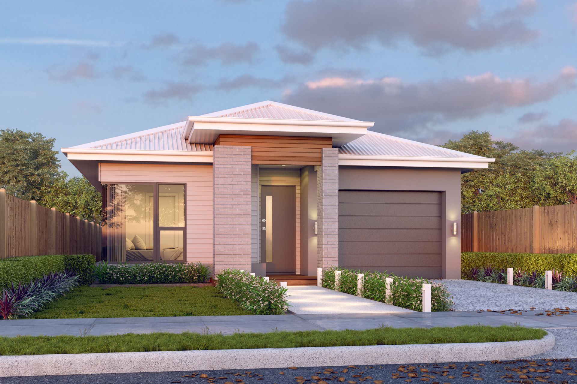 A House With a Large Garage and Plants in Front — Kareela Constructions In Hillvue, NSW