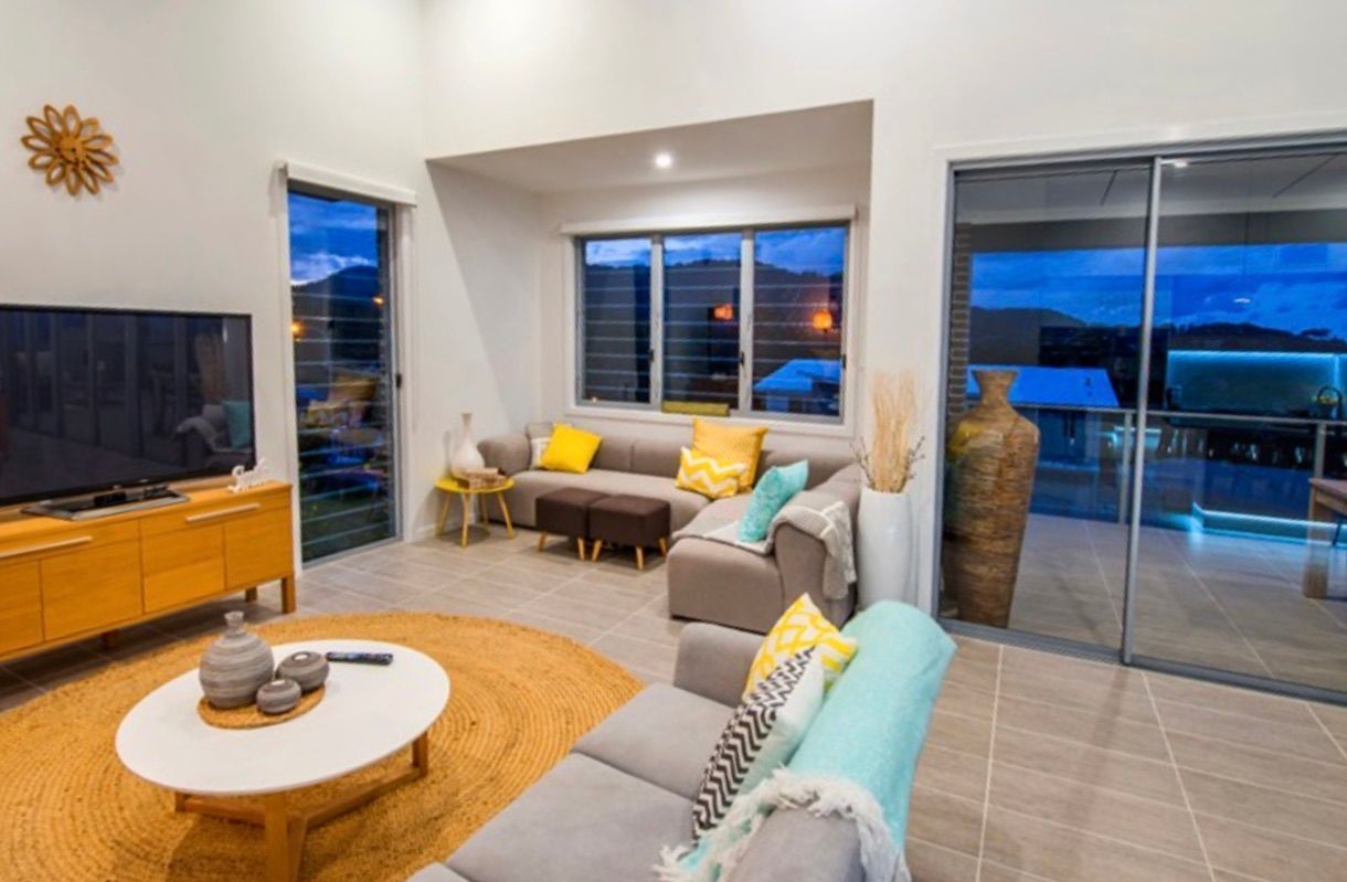 A Living Room Filled With Furniture and a Flat Screen Tv — Kareela Constructions In Tamworth, NSW