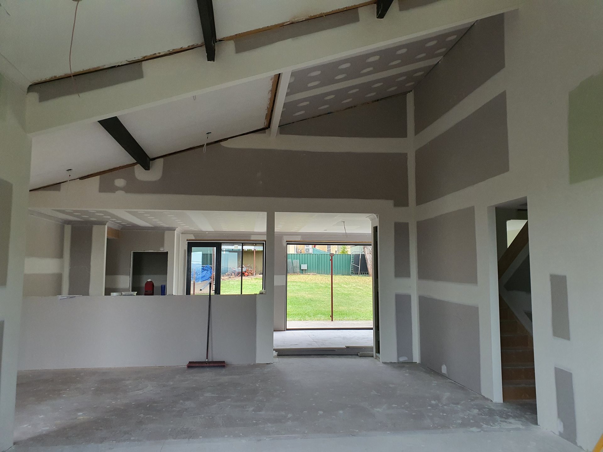 An Empty Room With a Broom in the Middle of It — Kareela Constructions In Tamworth, NSW