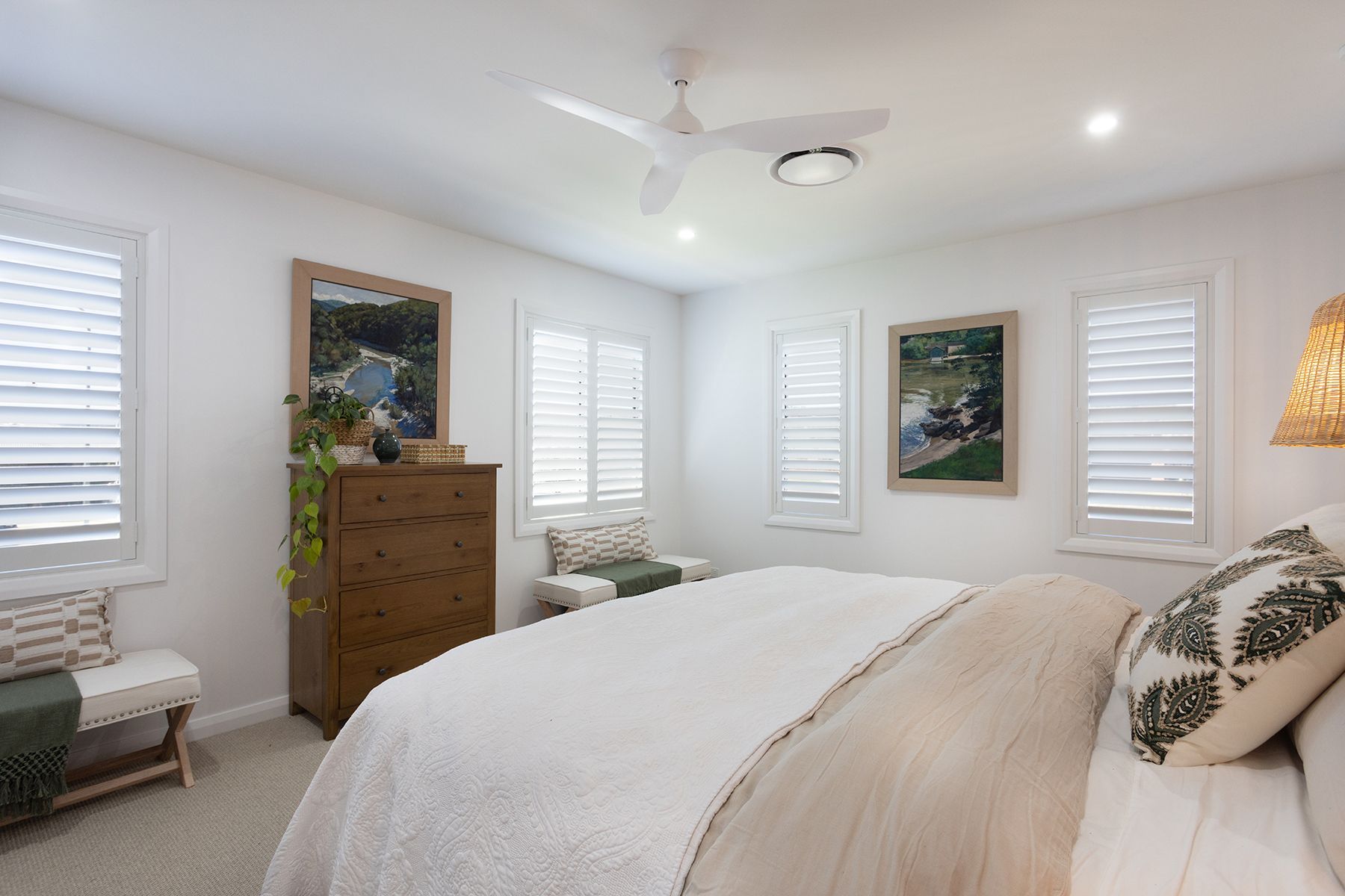 A Bedroom With a Bed a Nightstand and a Mirror — Kareela Constructions In Tamworth, NSW