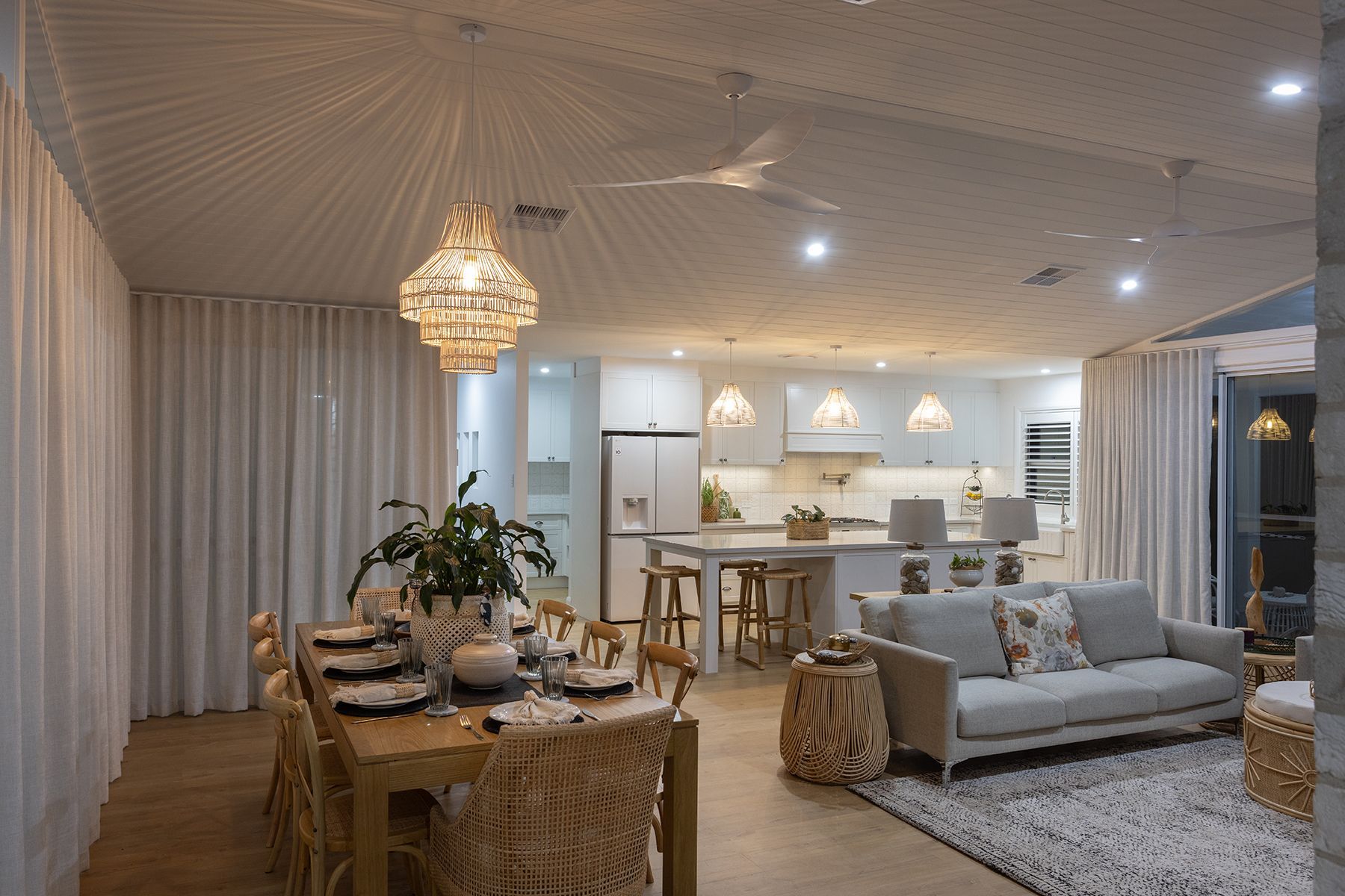 A Living Room With a Couch, Chair, Table and Television — Kareela Constructions In Tamworth, NSW