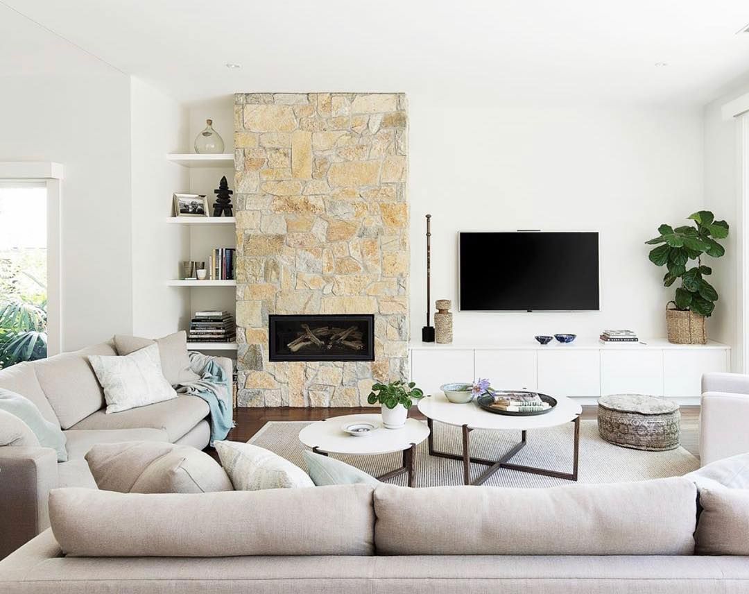 A Living Room With a Couch, Fireplace, and Television — Kareela Constructions In Tamworth, NSW