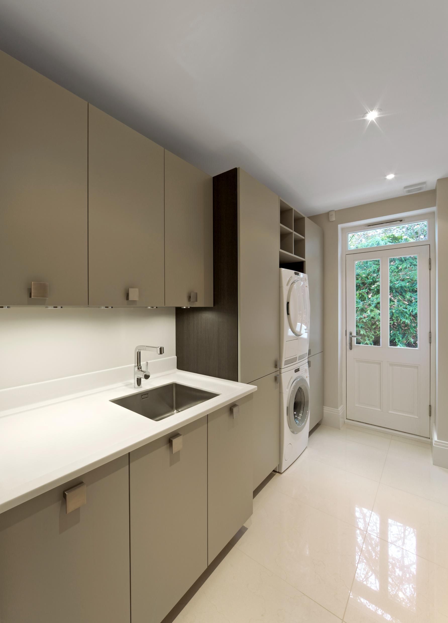 A Kitchen With a Sink and a Washer and Dryer — Kareela Constructions In Tamworth, NSW