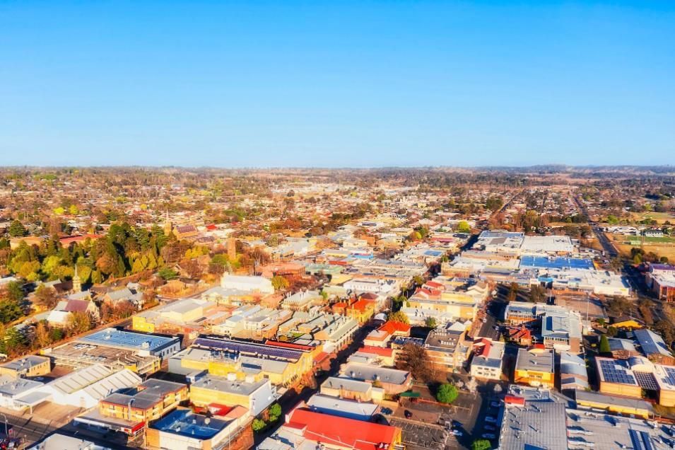 An Aerial View of a City With Lots of Buildings and Trees — Kareela Constructions In Armidale, NSW