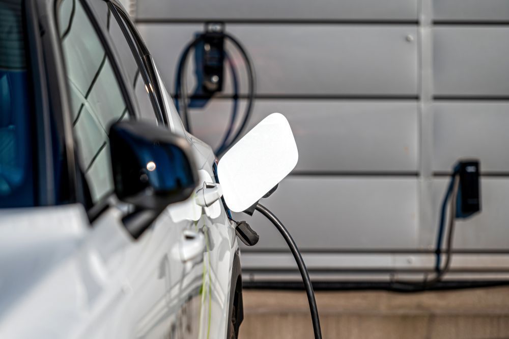 Residential Electrical Contractor - A house with cars parked in front of it at night
