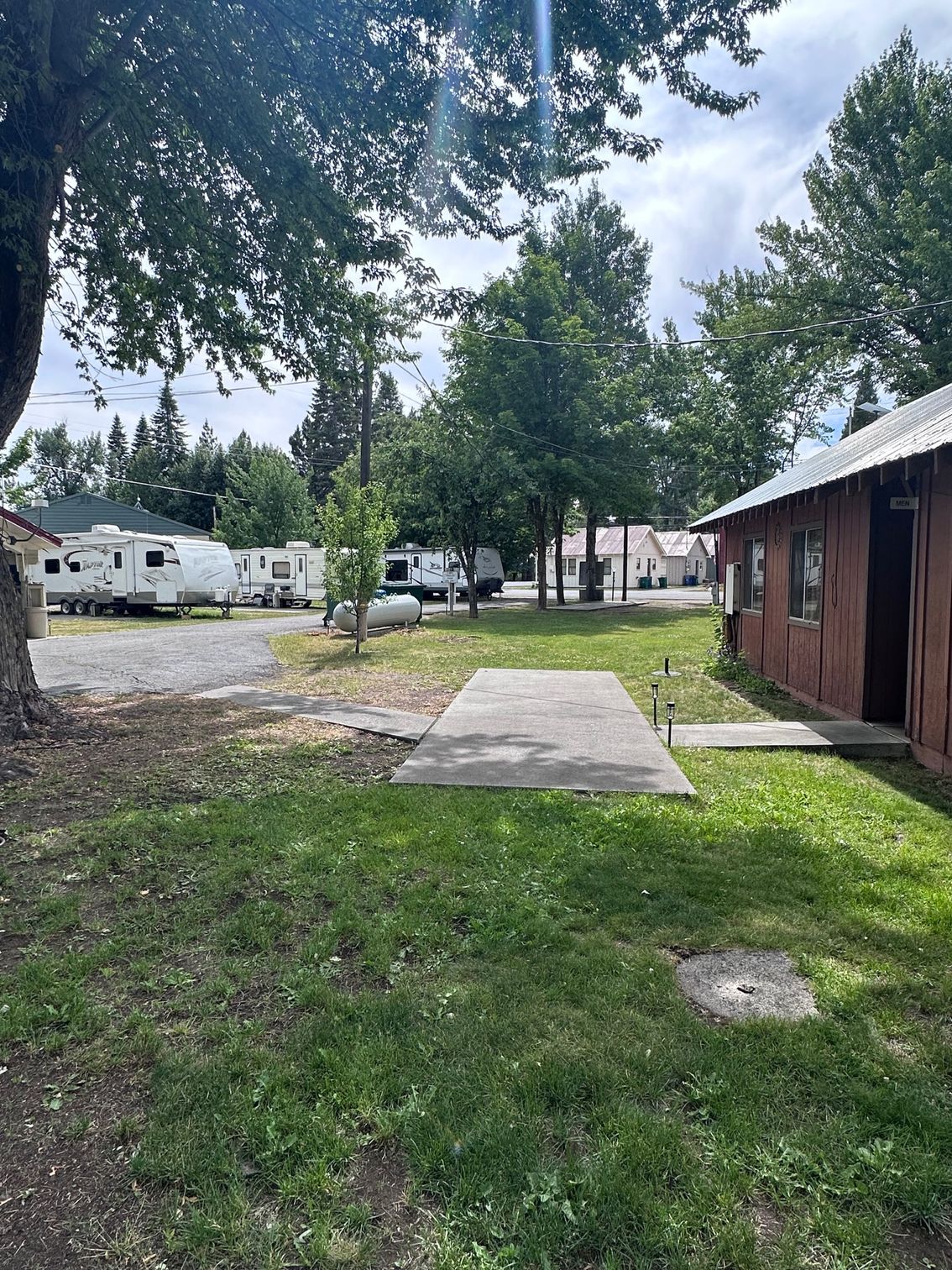 There are a lot of rvs parked in this area.